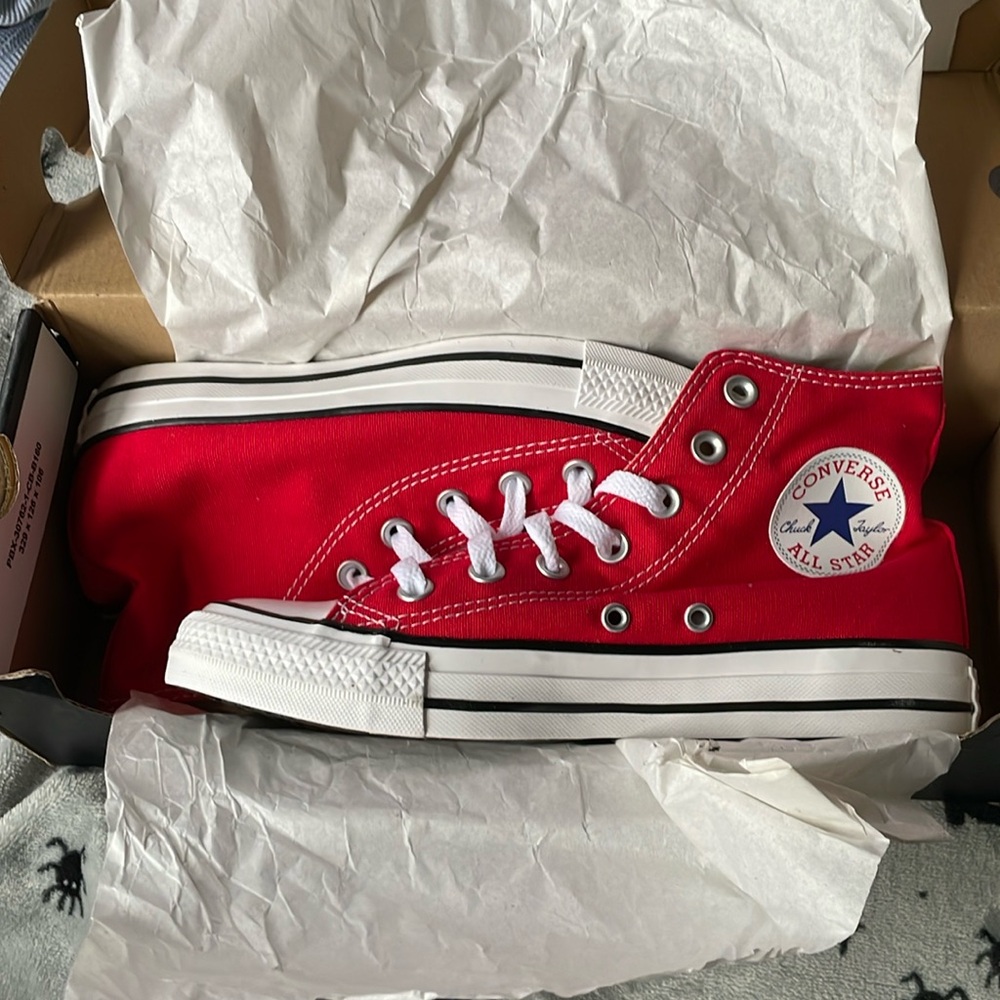 Converse red high tops. size 5 men’s and 7 women’s.